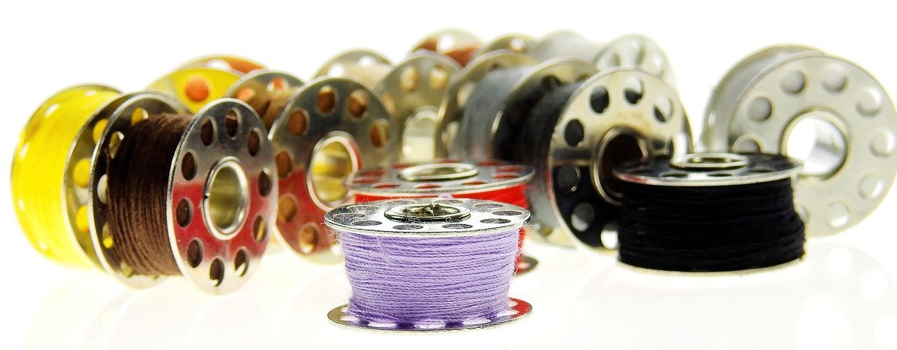 multiple bobbins isolated on white background